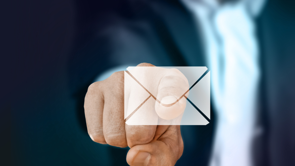 image of a person reaching out to click on an email icon. learn how to spot fake links to stay safe.