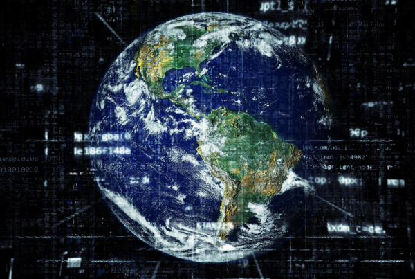 image of a globe with programing text over it. global events can impact your data recovery strategy.